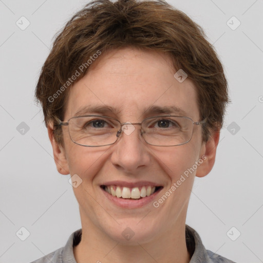 Joyful white adult female with short  brown hair and grey eyes