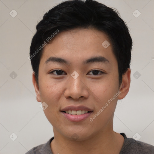 Joyful asian young-adult male with short  black hair and brown eyes