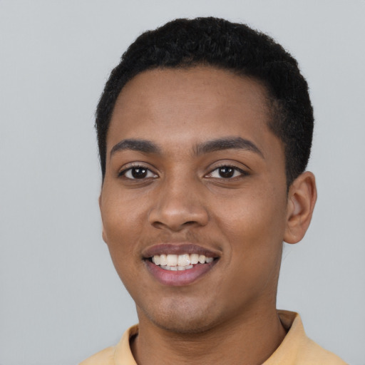 Joyful black young-adult male with short  black hair and brown eyes