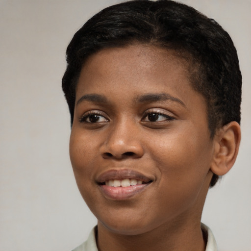 Joyful black young-adult female with short  brown hair and brown eyes