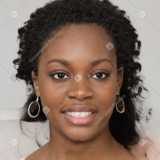 Joyful black young-adult female with medium  black hair and brown eyes