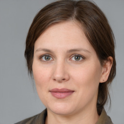 Joyful white adult female with medium  brown hair and brown eyes