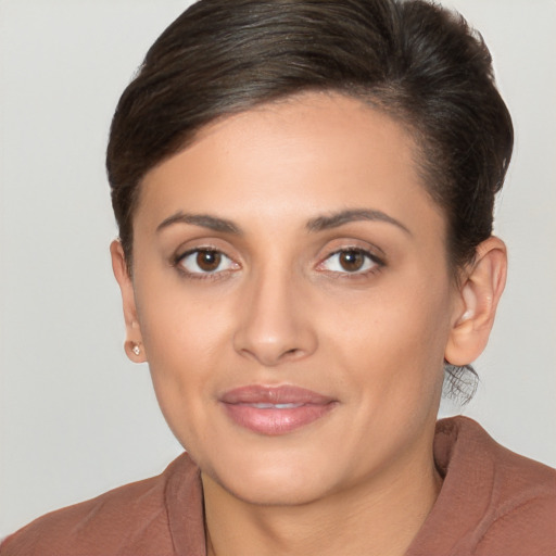 Joyful white young-adult female with short  brown hair and brown eyes