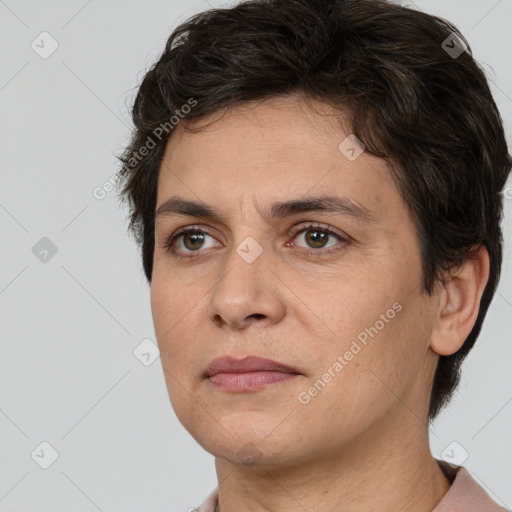 Joyful white adult female with short  brown hair and brown eyes