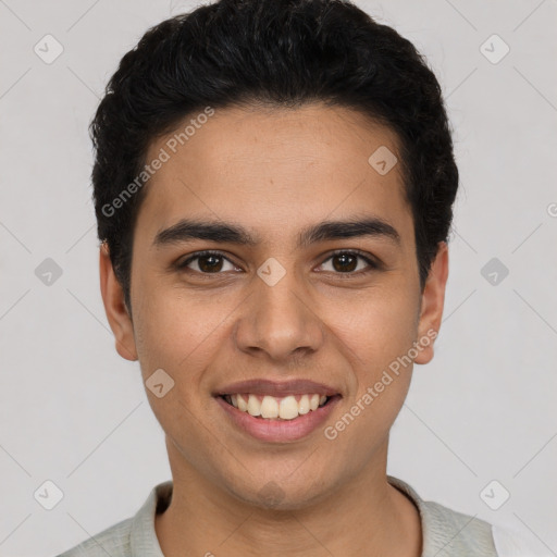 Joyful white young-adult male with short  black hair and brown eyes