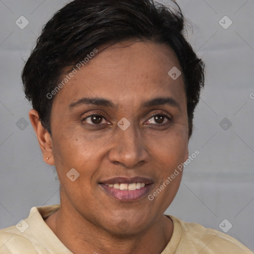 Joyful latino adult female with short  brown hair and brown eyes