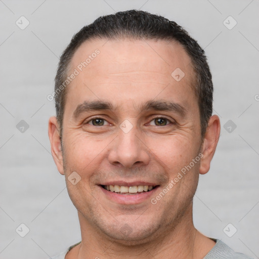 Joyful white adult male with short  brown hair and brown eyes