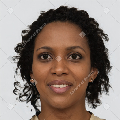 Joyful black young-adult female with medium  brown hair and brown eyes