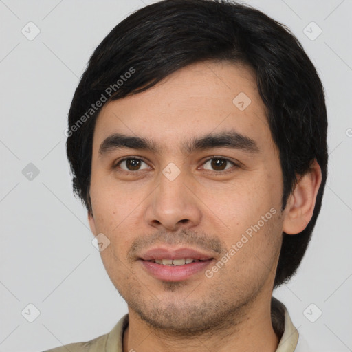 Joyful white young-adult male with short  black hair and brown eyes