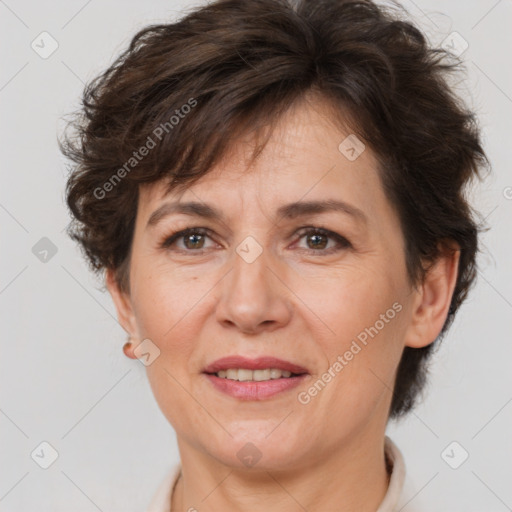 Joyful white adult female with short  brown hair and brown eyes