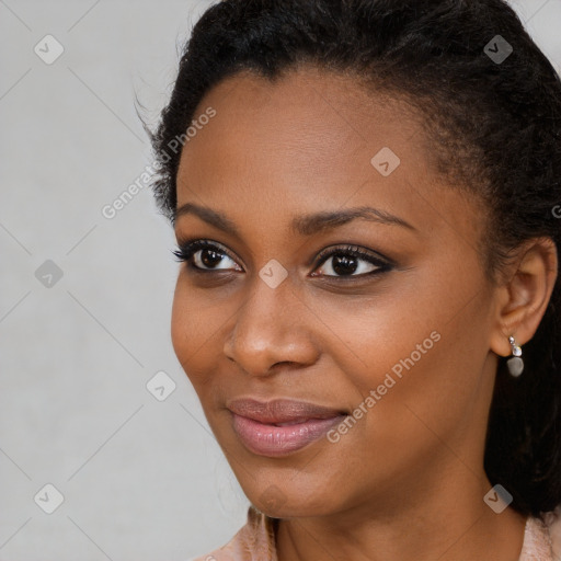 Joyful black young-adult female with long  brown hair and brown eyes