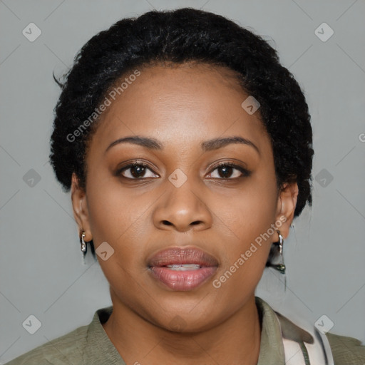 Joyful black young-adult female with short  black hair and brown eyes