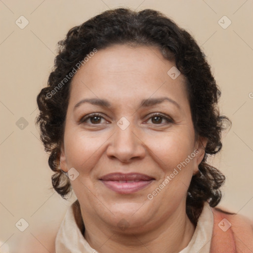 Joyful latino adult female with medium  brown hair and brown eyes