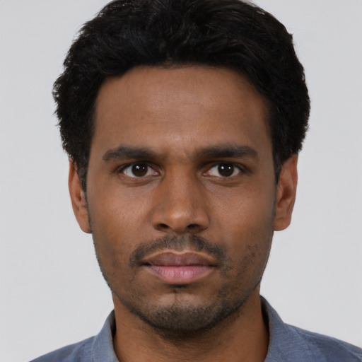Neutral black young-adult male with short  black hair and brown eyes