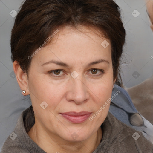 Joyful white adult female with medium  brown hair and brown eyes