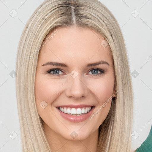 Joyful white young-adult female with long  brown hair and blue eyes