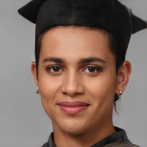 Joyful latino young-adult female with short  black hair and brown eyes