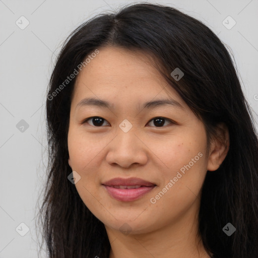 Joyful asian young-adult female with long  brown hair and brown eyes