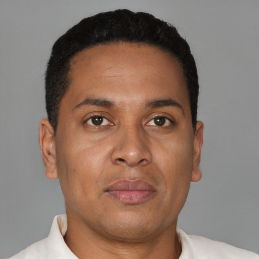 Neutral latino adult male with short  black hair and brown eyes
