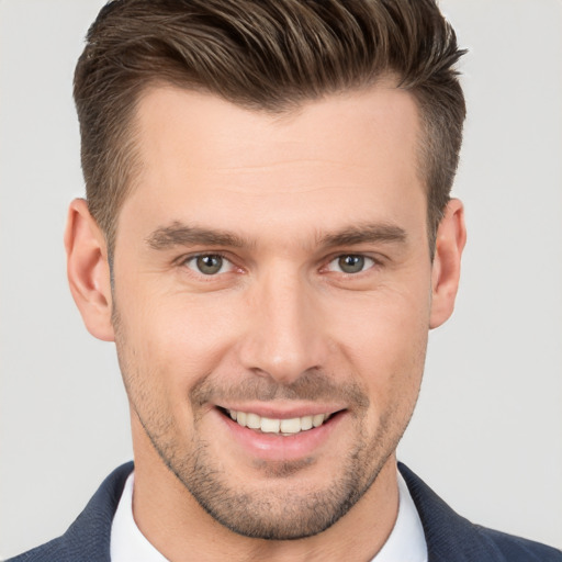 Joyful white young-adult male with short  brown hair and brown eyes