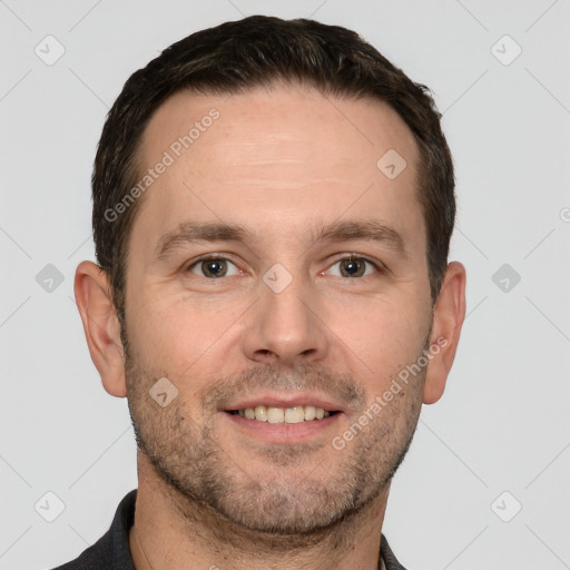 Joyful white adult male with short  brown hair and grey eyes