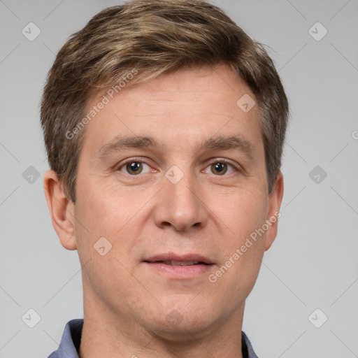 Joyful white adult male with short  brown hair and grey eyes