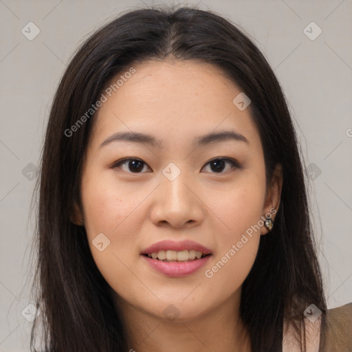 Joyful asian young-adult female with long  brown hair and brown eyes