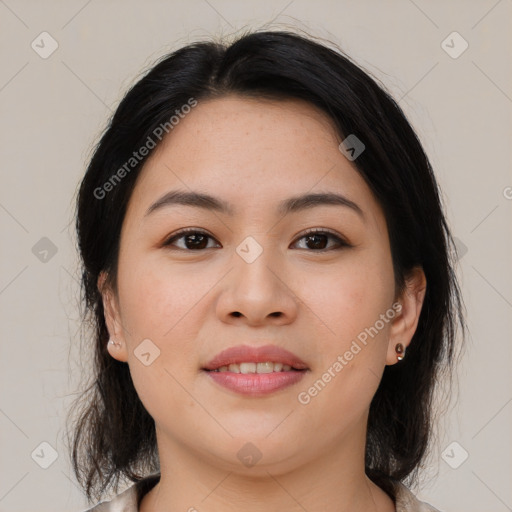 Joyful asian young-adult female with medium  brown hair and brown eyes