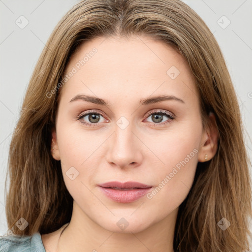 Joyful white young-adult female with long  brown hair and green eyes