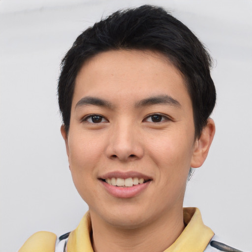 Joyful asian young-adult male with short  black hair and brown eyes