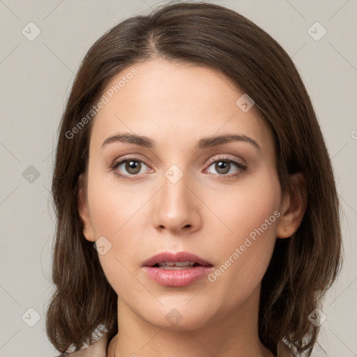 Neutral white young-adult female with medium  brown hair and brown eyes