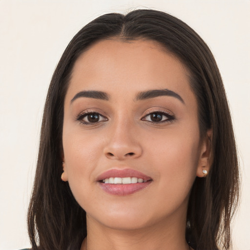 Joyful white young-adult female with long  brown hair and brown eyes