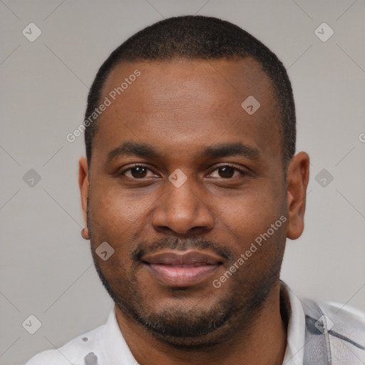 Joyful latino young-adult male with short  brown hair and brown eyes