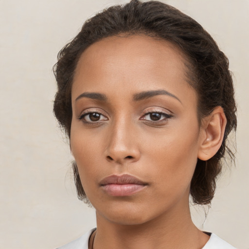 Neutral white young-adult female with medium  brown hair and brown eyes