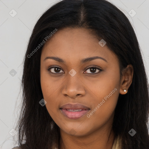 Joyful black young-adult female with long  brown hair and brown eyes