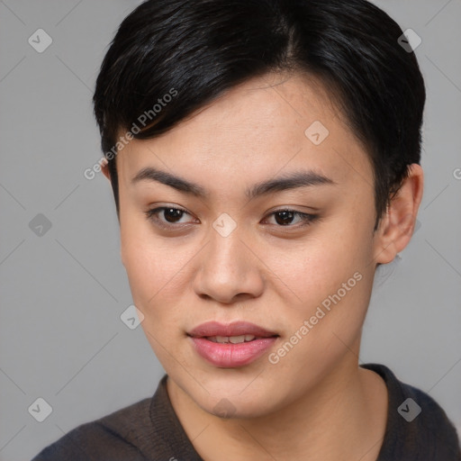 Joyful asian young-adult female with short  brown hair and brown eyes