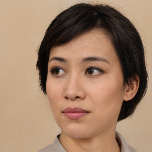 Neutral asian young-adult female with medium  brown hair and brown eyes