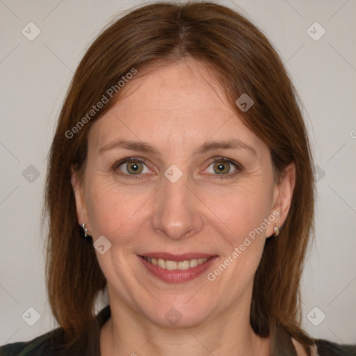 Joyful white adult female with medium  brown hair and grey eyes