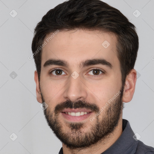 Joyful white young-adult male with short  black hair and brown eyes