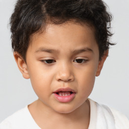 Joyful white child male with short  brown hair and brown eyes