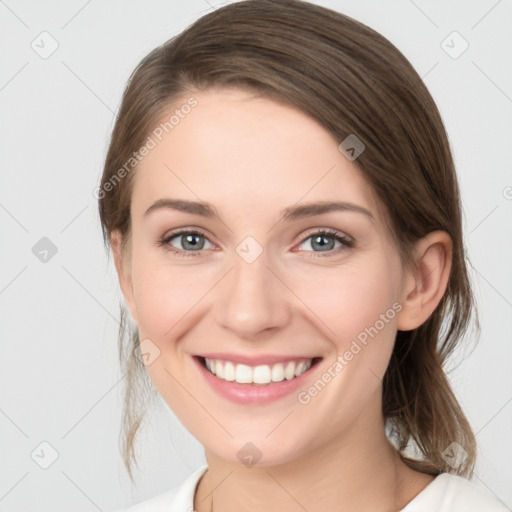 Joyful white young-adult female with medium  brown hair and green eyes