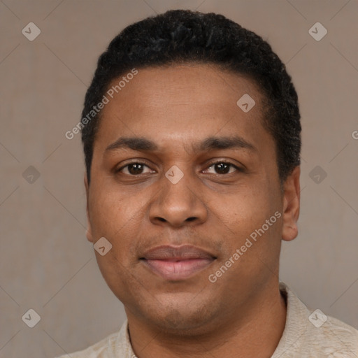 Joyful black young-adult male with short  black hair and brown eyes