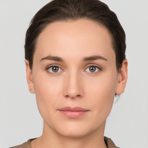 Neutral white young-adult female with short  brown hair and brown eyes