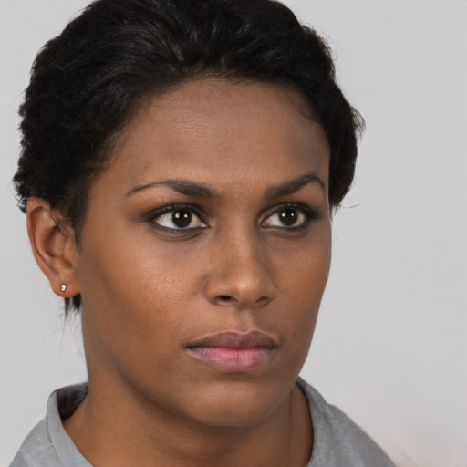Neutral black young-adult female with short  brown hair and brown eyes
