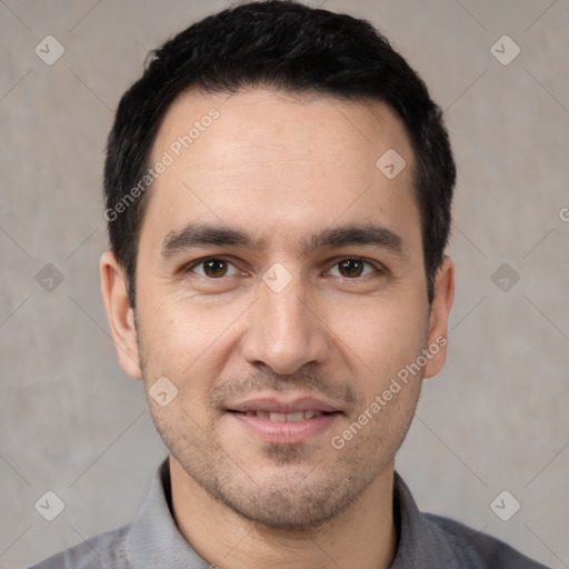 Joyful white young-adult male with short  black hair and brown eyes