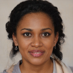 Joyful black young-adult female with medium  brown hair and brown eyes