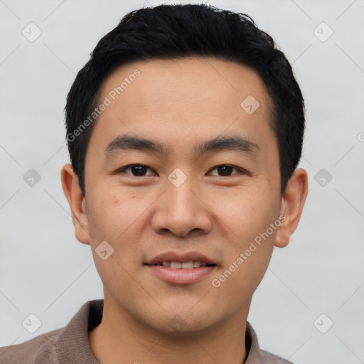 Joyful asian young-adult male with short  black hair and brown eyes