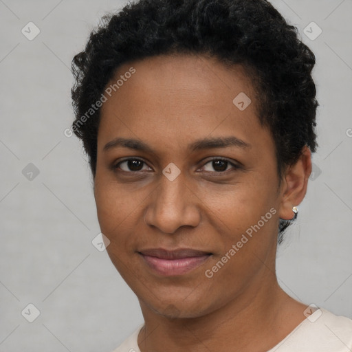 Joyful black young-adult female with short  brown hair and brown eyes