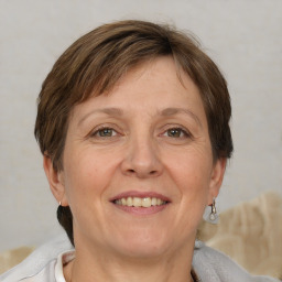 Joyful white adult female with short  brown hair and brown eyes