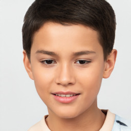 Joyful white child male with short  brown hair and brown eyes